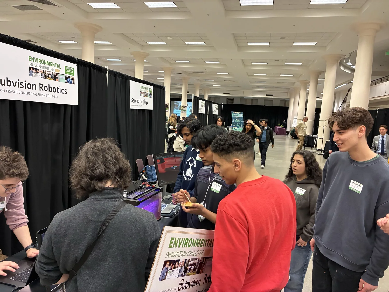 Visitors gathered around the Subvision booth