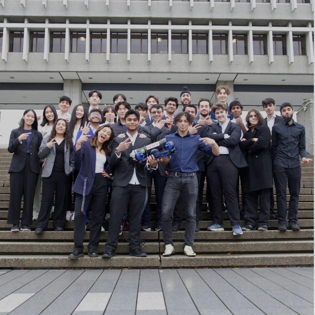 Subvision team standing together with the rover