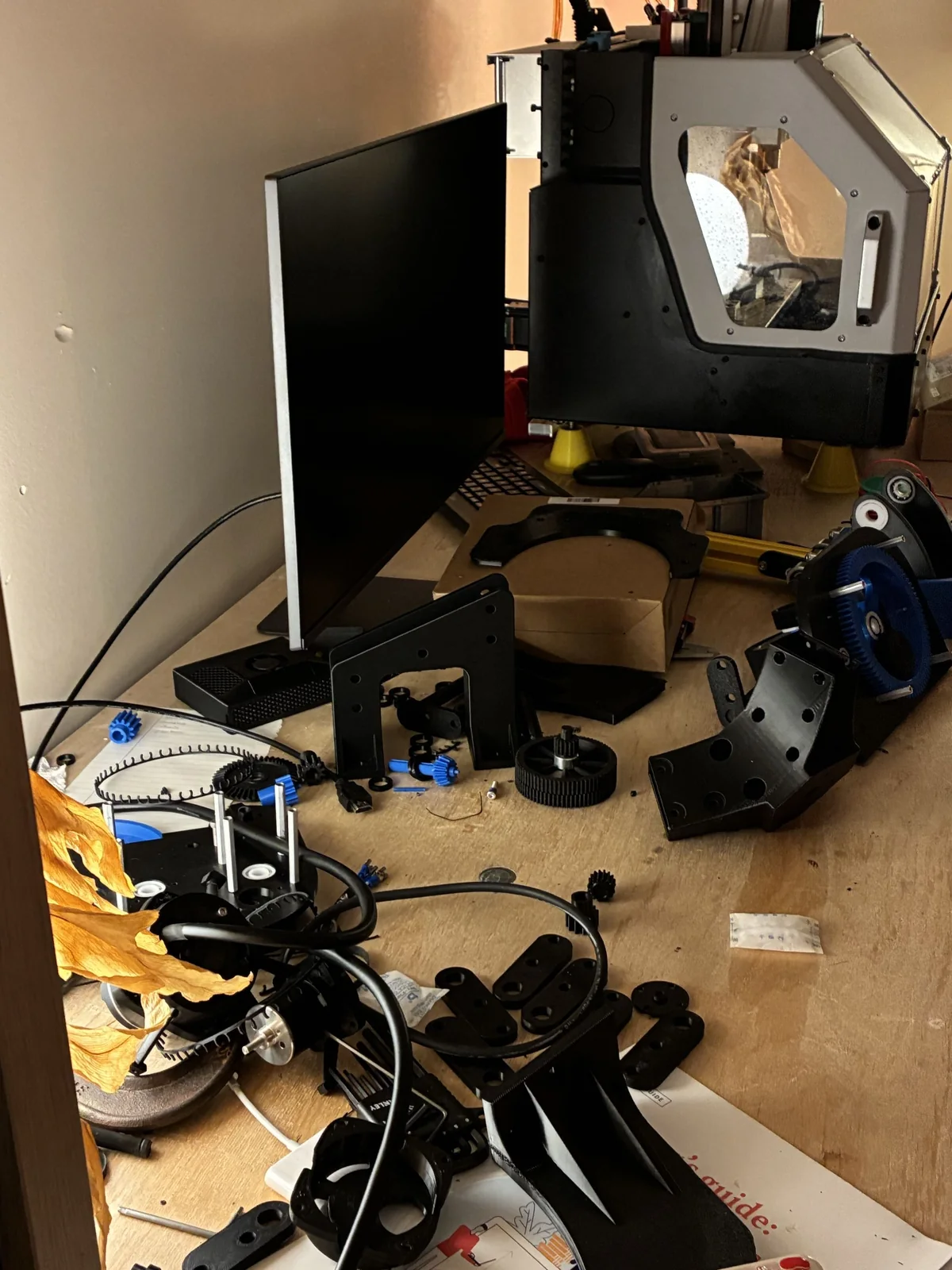 Swerve-drive housings, gears and components laid out on the workbench